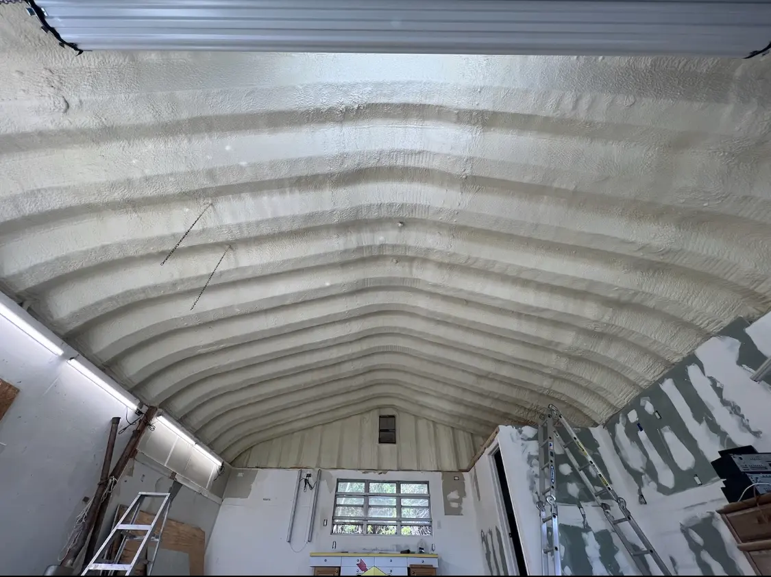 Spray polyurethane foam applied to the underside of a metal roof deck in Lawrenceburg